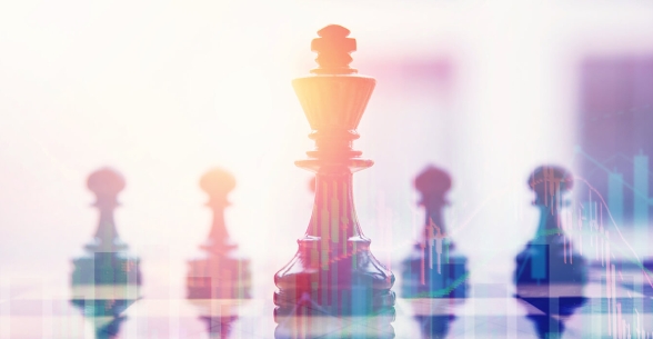 Transparent image of charts over an image of a chess game.
