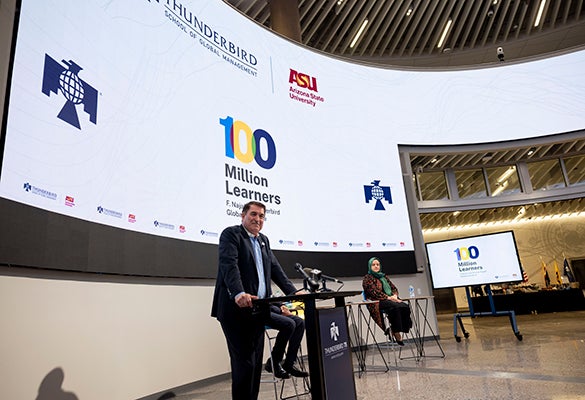 Image of Najafi presenting the 100 Million Learners initiative in Thunderbird's Global Forum