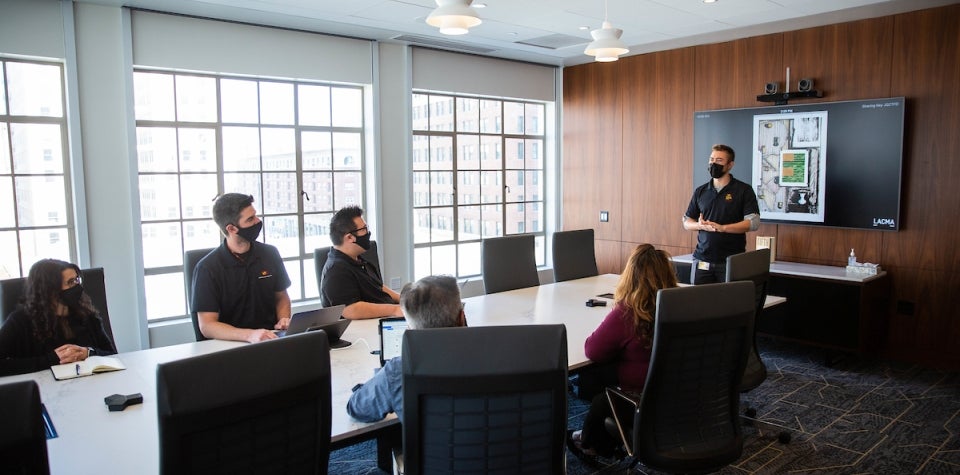 ASU staff member Aleks Malczewski addresses fellow staff members during a staff meeting the fifth floor executive conference room in the California Center in downtown Los Angeles, Calif. on Wednesday afternoon Nov. 3rd, 2021. 