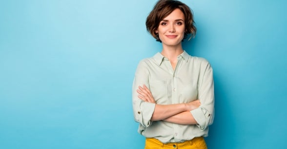 Image of a confident woman on a blue background.
