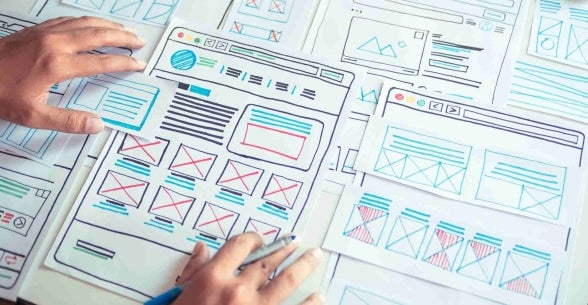 A website designer goes over sketches to test accessibility.