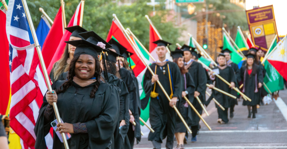 Image showing Thunderbird students participating in the parade of flags